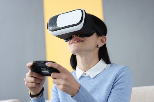 young-woman-virtual-reality-glasses-holding-joystick-gambling-addiction-concept